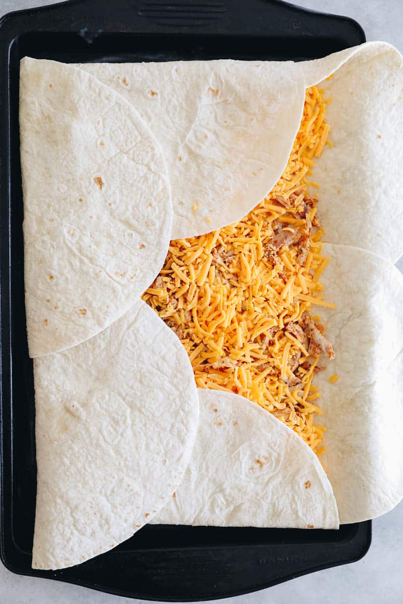 sheet pan quesadillas with shredded cheese and chicken